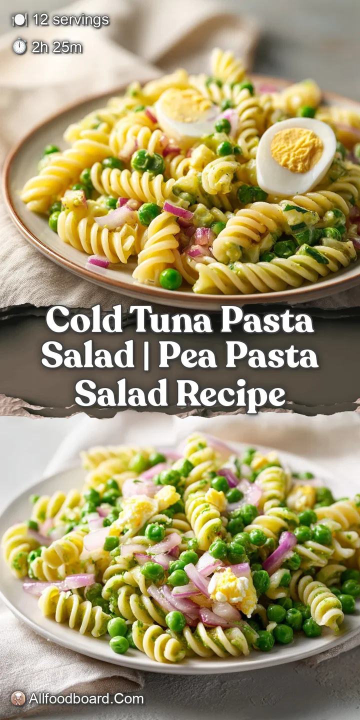 Close-up of creamy pasta spirals mixed with flaked tuna, bright orange carrots, and green peas in a rich dressing.