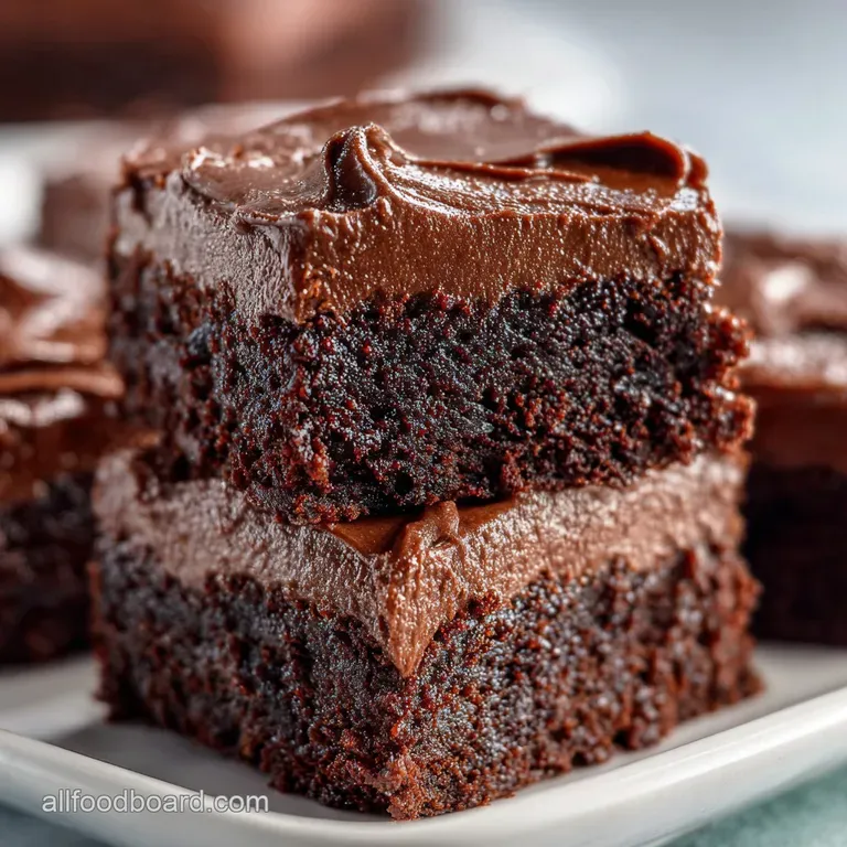 Single, fudgy brownie square with decadent chocolate frosting, topped with flaky sea salt on a white plate, elegant and si...