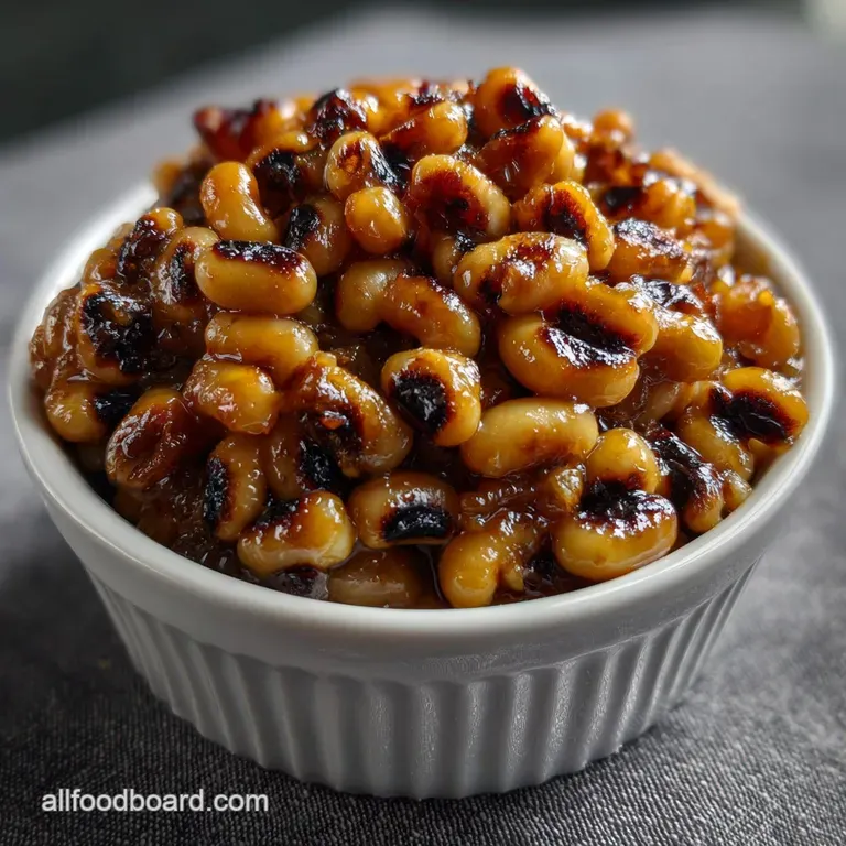 A single portion of vibrant green pot liquor served in a shallow white bowl, garnished with a swirl of fresh herbs and a c...
